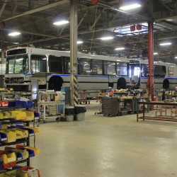 A Massachusetts Bay Transportation Authority bus being serviced can be seen on Sept. 28, 2016, at the Maine Military Authority's facility at the Loring Commerce Centre in Limestone. (Anthony Brino | Staff Writer)