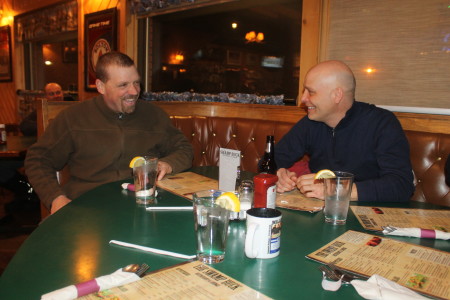 Martin Massicotte, right, and Denis Tremblay share Can Am stories and others at the Swamp Buck in Fort Kent on Thursday, March 2. (Jessica Potila | SJVT/FhF)