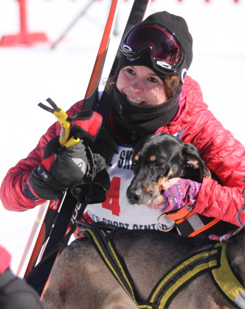 Marie Parent gives her dog a hug after crossing the finish line at the 6K skijoring races at Fort Kent Outdoor Center, Sunday, March 5. (Don Eno | SJVT/FhF)
