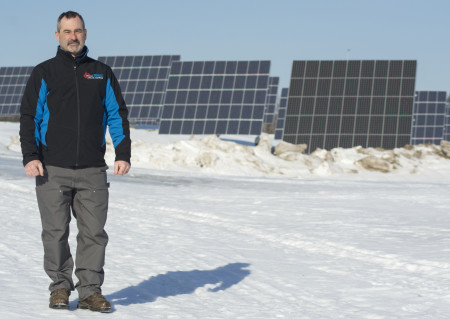 Dale Roy, of Maine Solar and Wind, recently installed a private Solar Farm for Neal Griffeth to use for his local businesses. The farm, located on the Van Buren Road in Caribou, contains 945 panels with the capacity to produce 247 kilowatts of energy per hour. (Christopher Bouchard | BDN)