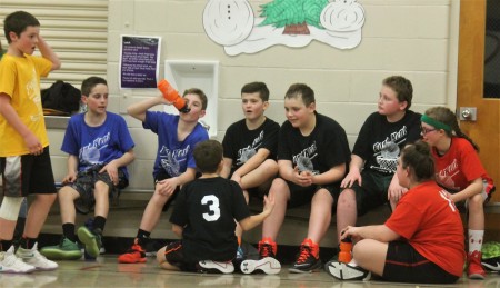 Fort Kent Parks and Recreation Department volunteer Coach Robert St. Germain said seeing kids compete with one another on the basketball court and then gather as friends in-between games is what rec basketball is all about. From left (back): Ethan Daigle, Lance Gagnon, Keegan Cyr, Pierson Caron, Nathan Dionne, Alex Nadeau and Larissa Daigle. Upfront: Blake Beaulieu and Gracie Landry. (Jessica Potila | SJVT/FhF)