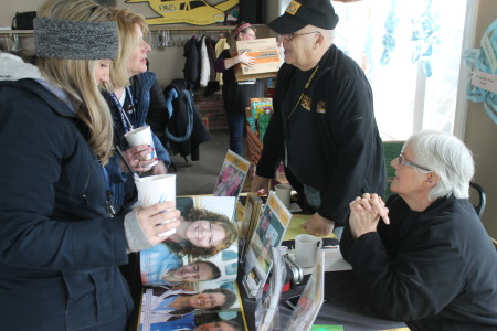 Joel and Rinette Jandreau, volunteers with Patient Air Lift Services, talk with people at Angel Snowfest, Saturday, March 11, at the Lakeview Restaurant in St. Agatha. PALS is one of three organizations for which Snowfest raises funds. (Don Eno | SJVT/FhF)