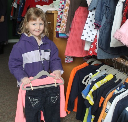 Three-year-old Charlotte Lake found some good bargains on gently used name-brand clothing while shopping with her mother Lauren at the new Little Daniel's Den store in Fort Kent on Monday, March 13. (Jessica Potila | SJVT/FhF)