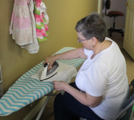 Carolyn Daigle helps her daughter Melanie Daigle prepare for the opening of Little Daniel's Den in Fort Kent on Monday, March 13. (Jessica Potila | SJVT/FhF)