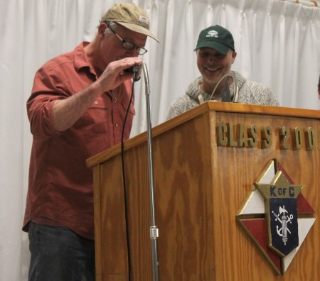 Can-Am Crown 250 Race Marshal Don Hibbs, left, helps translate a speech from French to English for champion musher Martin Massicotte at an annual awards banquet for the international sled dog race on Tuesday, March 7 at the Knights of Columbus Hall in Fort Kent. (Jessica Potila | SJVT/FhF)