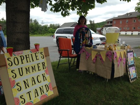Sophie Saunders exercised her entrepreneurial talents on Saturday, July 9, managing a summer snack stand to raise funds for the cat rescue organization PAWS. (Contributed/Jeannie Nadeau)