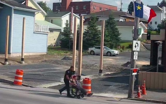 police officer rolls man in wheelchair a quarter of a mile uphill fiddlehead focus fiddlehead focus